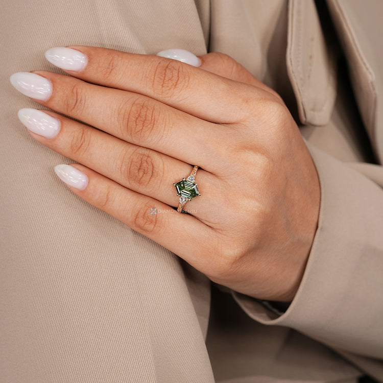 Hexagon diamond ring with six claw prong setting.