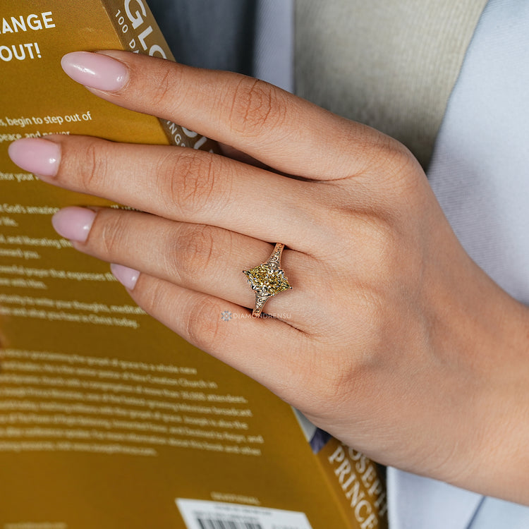 Dutch marquise ring with flower buds prong setting.