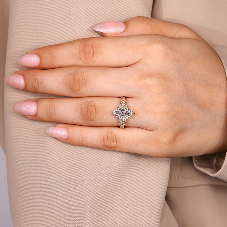 Marquise ring round side stones leaf detailing.