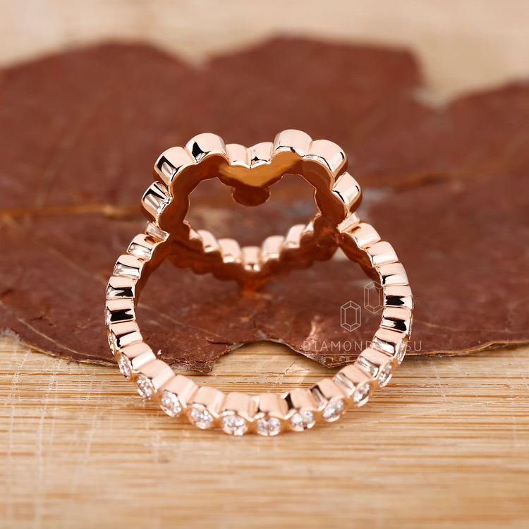 Lab grown diamond bezel ring with pave detail.
