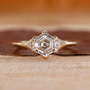 Hexagon step cut diamond ring triangle side stones.
