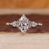 Marquise diamond ring kite round side stones muse set.

