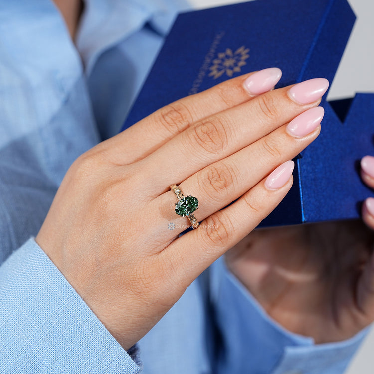 Oval diamond ring with vintage milgrain setting.