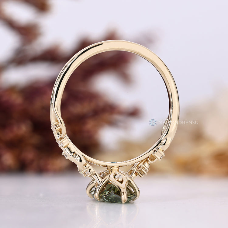 Handmade green diamond ring with tulip basket setting.