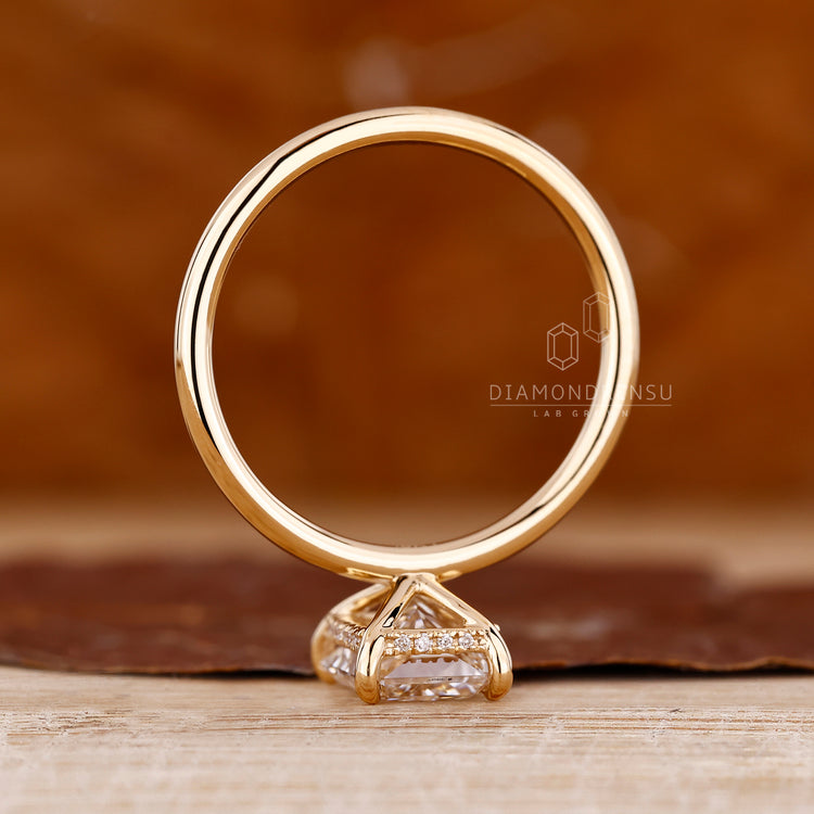 Lab grown diamond radiant cut ring with hidden halo.