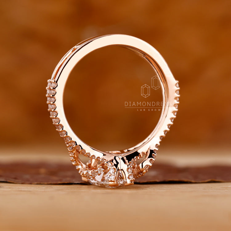 Pear diamond ring double pave prong setting style.
