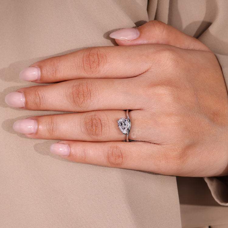 Handmade lab grown pear diamond ring design.
