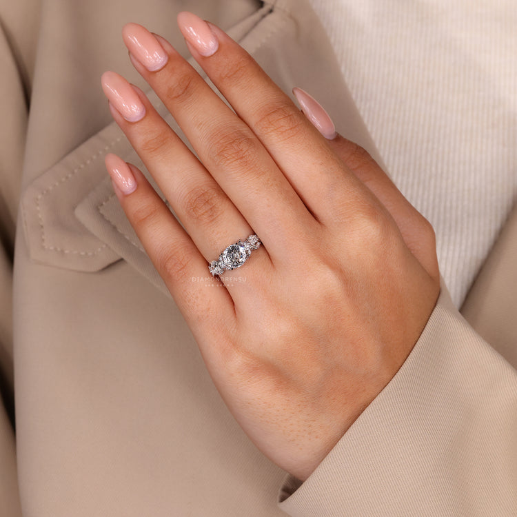 Portuguese diamond ring four claw prong pave setting.