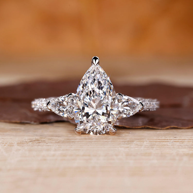 Cathedral diamond ring with pear cut centre stone.

