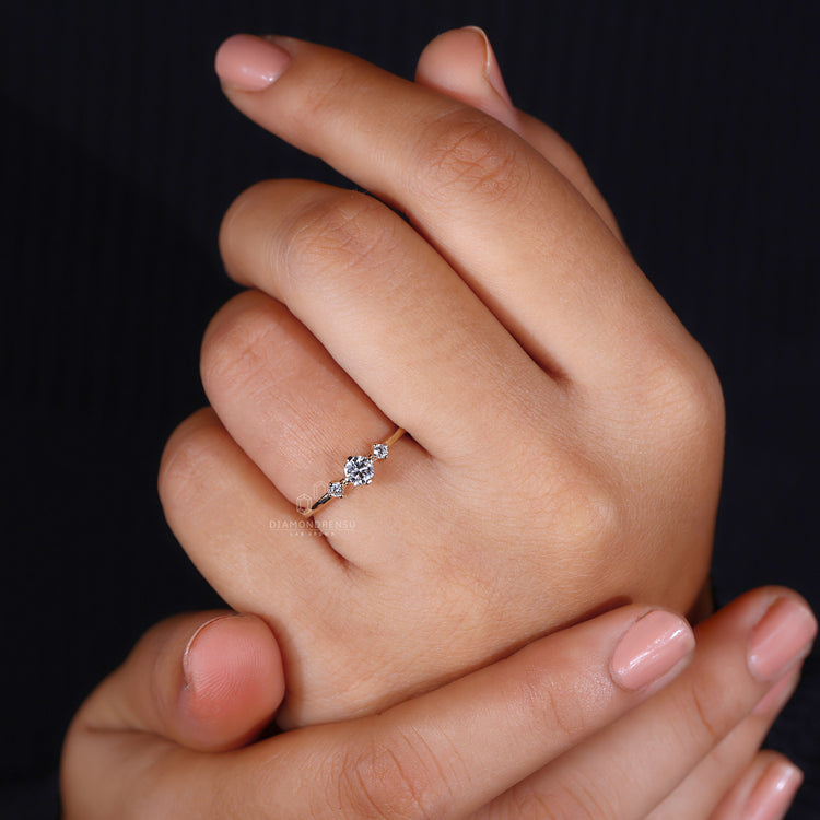 Round diamond ring modern three stone style.