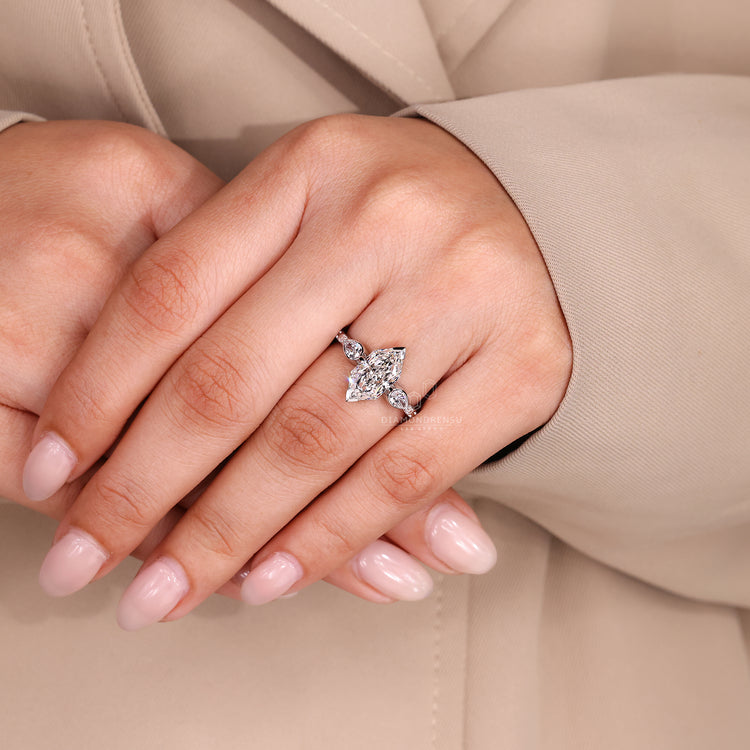 Three stone Dutch marquise ring with V prong setting.
