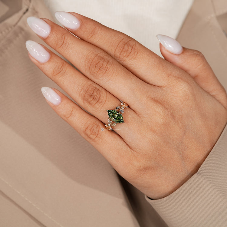 Green diamond Dutch marquise ring with side stones.