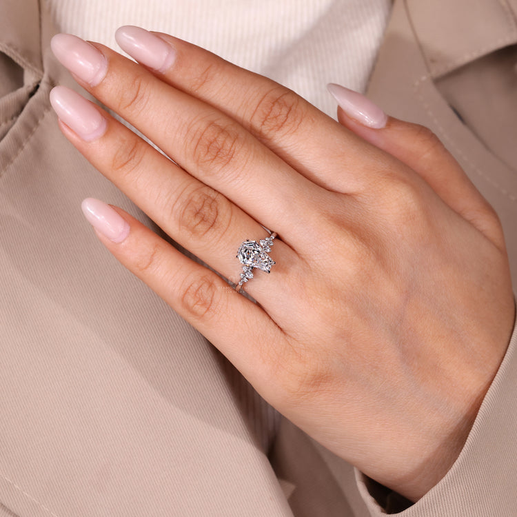 Coffin diamond ring round stones prong set.