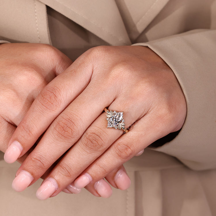 Lab grown diamond marquise ring with side stones.
