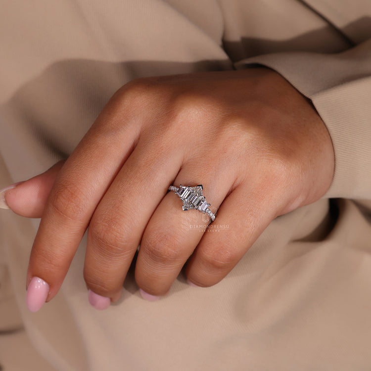 Hexagon step cut diamond ring with round pave stones
