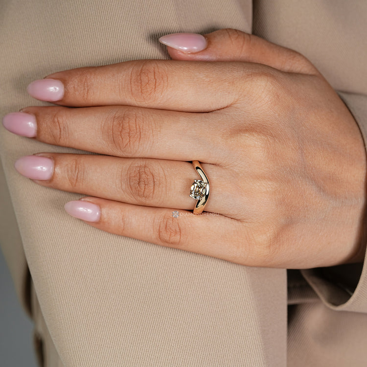 East to west old mine cushion diamond ring design.