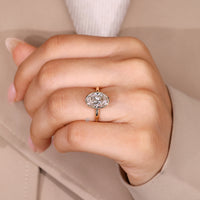 Oval cut diamond engagement ring with bezel setting.