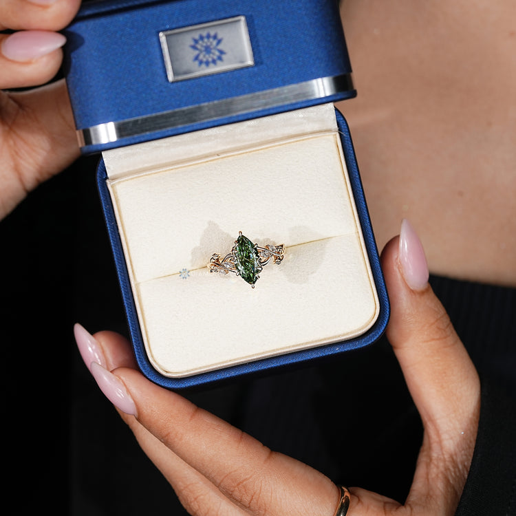 Marquise diamond ring with marquise side stones.