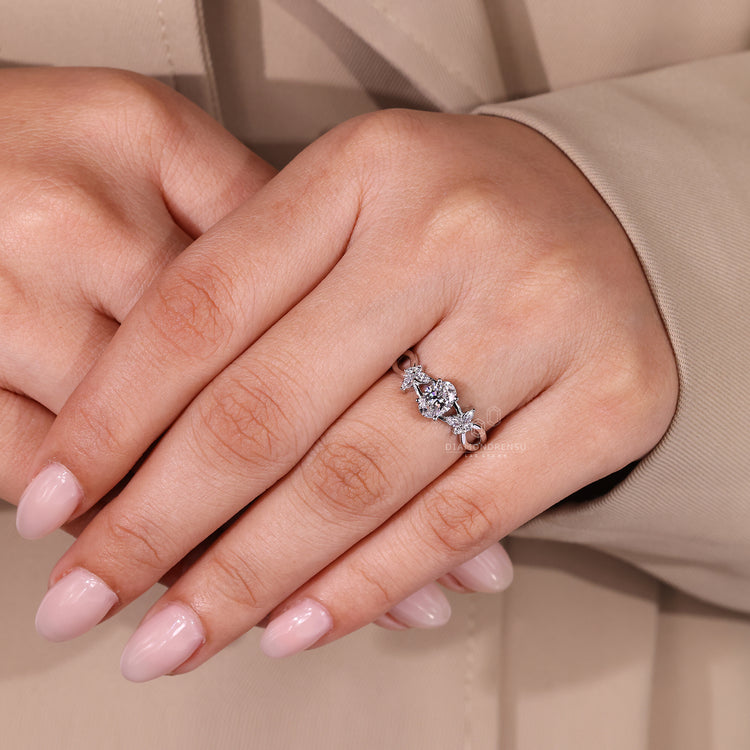 Oval diamond engagement ring with four prong setting.
