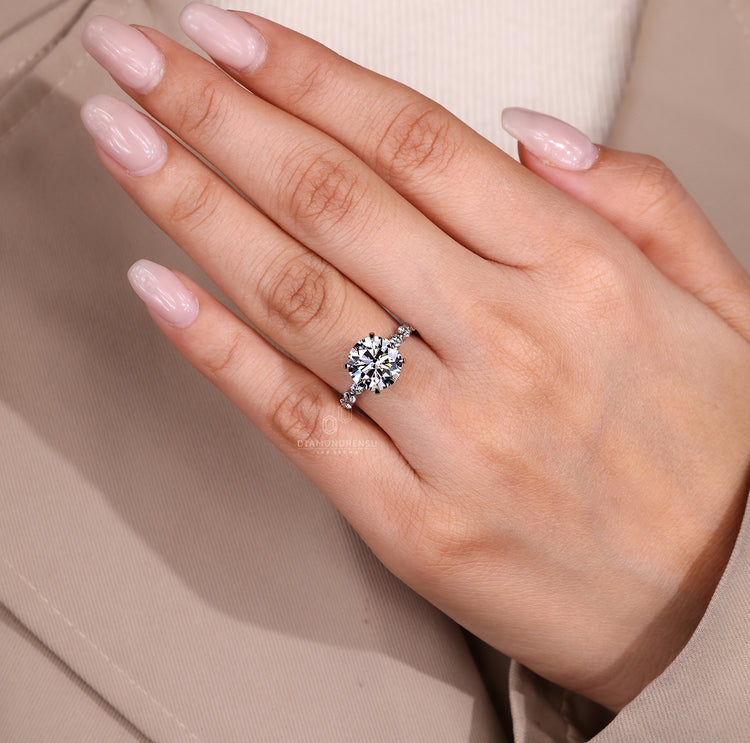 Handmade blue oval diamond ring with heart side stones.
