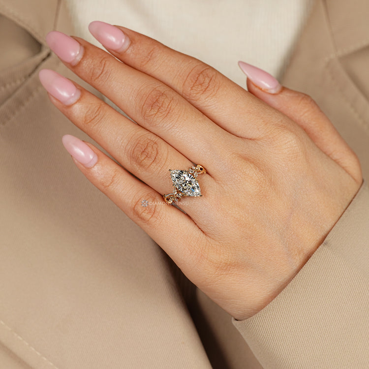 Nature inspired marquise ring with cluster detailing.