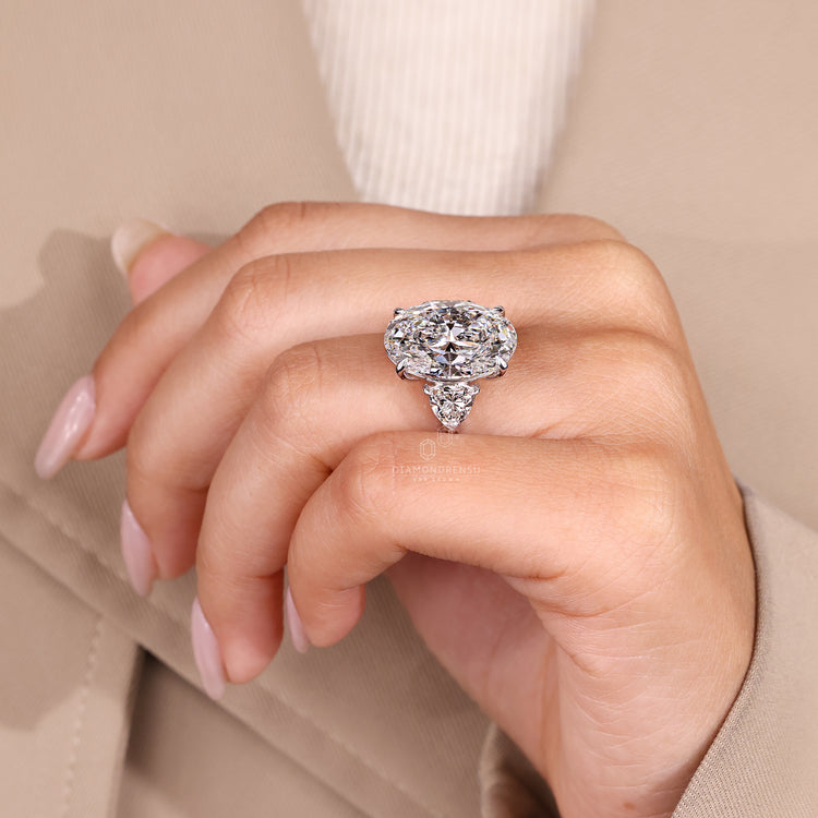 Lab grown diamond three stone oval engagement ring, IGI certified.