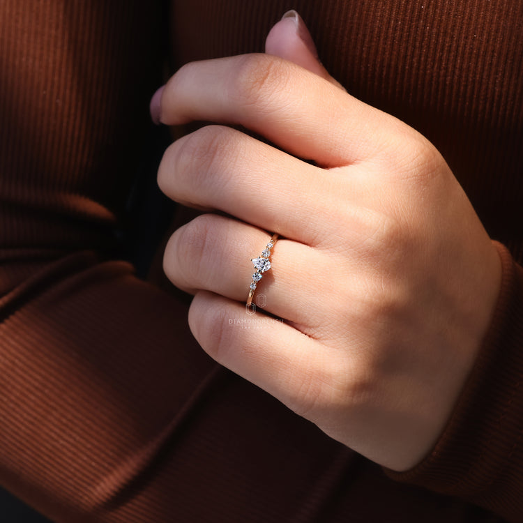 5 stone ring set with shared prong.
