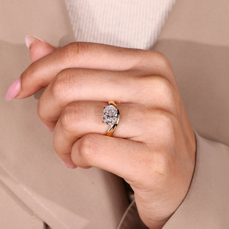 Contemporary oval lab diamond engagement ring with wave design