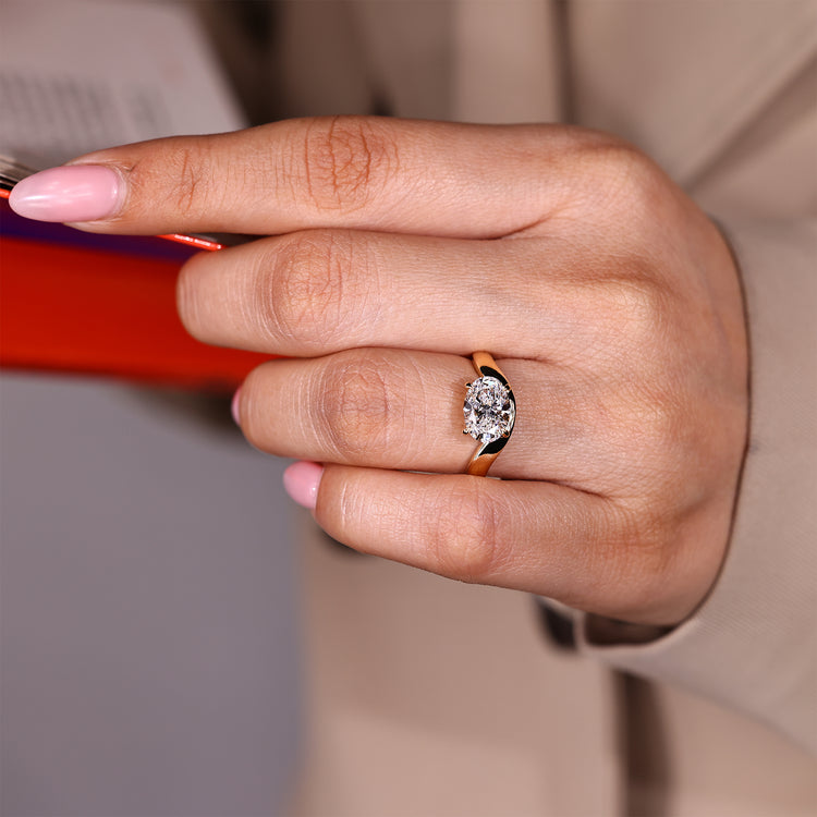 Elegant solitaire ring with oval lab created diamond and curved band