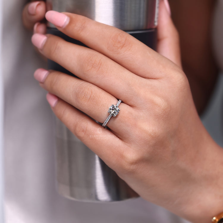 4 tab prong round diamond engagement ring.
