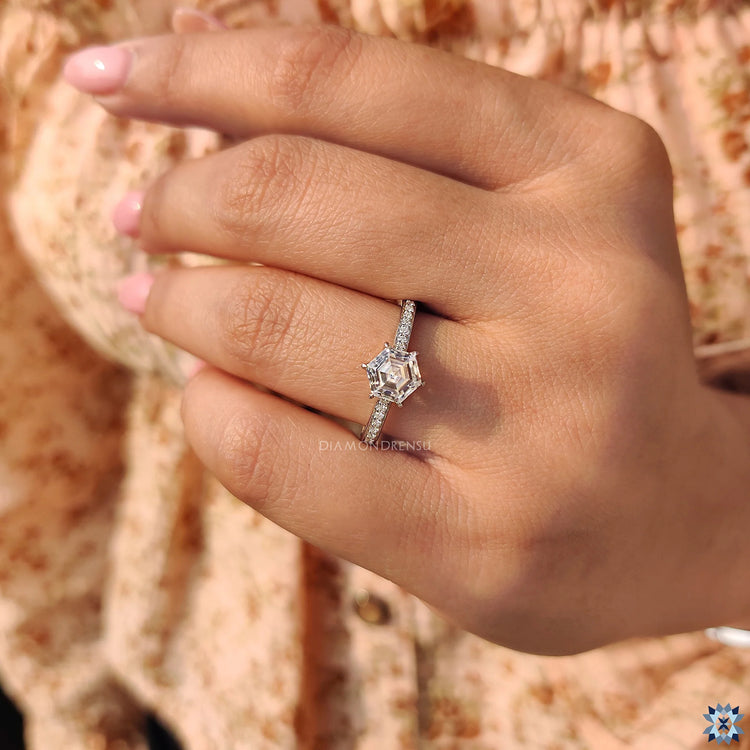 6 claw prong setting ring in white gold featuring a hexagon design.
