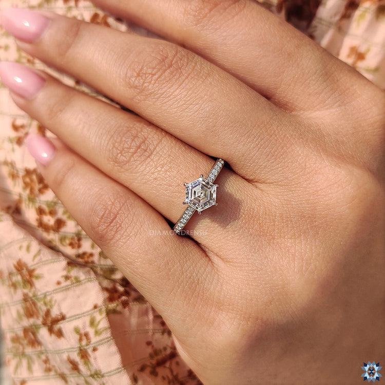 Handmade jewelry: hexagon engagement ring with 6 claw prong setting in white gold.
