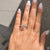 Handmade ring from Diamondrensu Australia featuring pave diamonds and a round cut