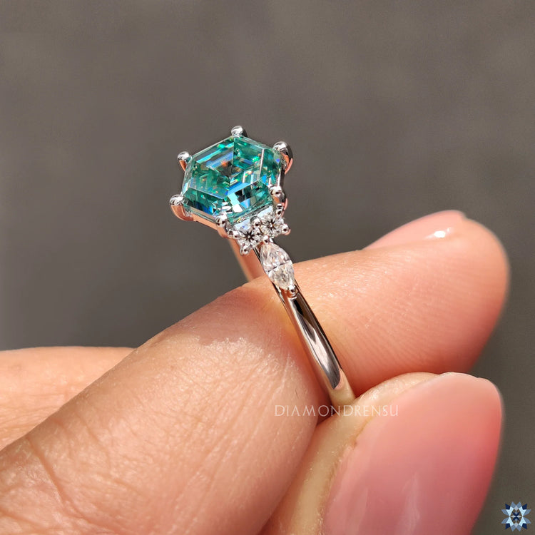 Marquise and round side stones create elegant sparkle and detail.
