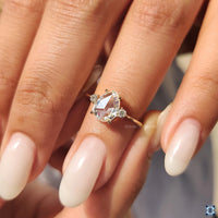 Handmade Jewelry: 3 Stone Engagement Ring with pear rose cut and a claw prong setting.
