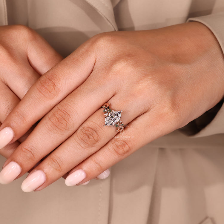 Dutch marquise diamond ring with Moss Agate side diamonds.
