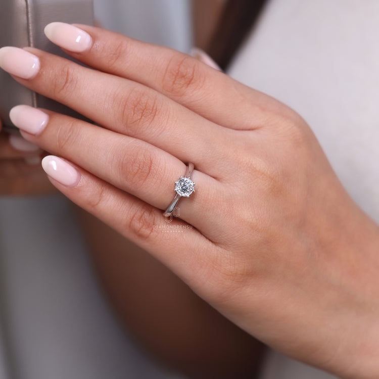 Gold solitaire ring with white gold diamond ring.
