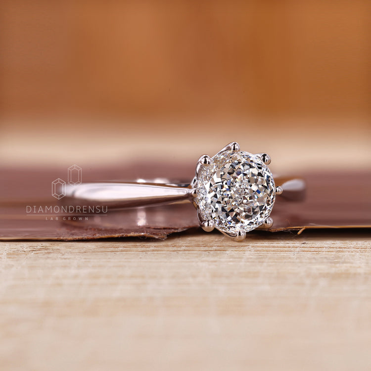 Cathedral setting ring suits Portuguese cut engagement ring.

