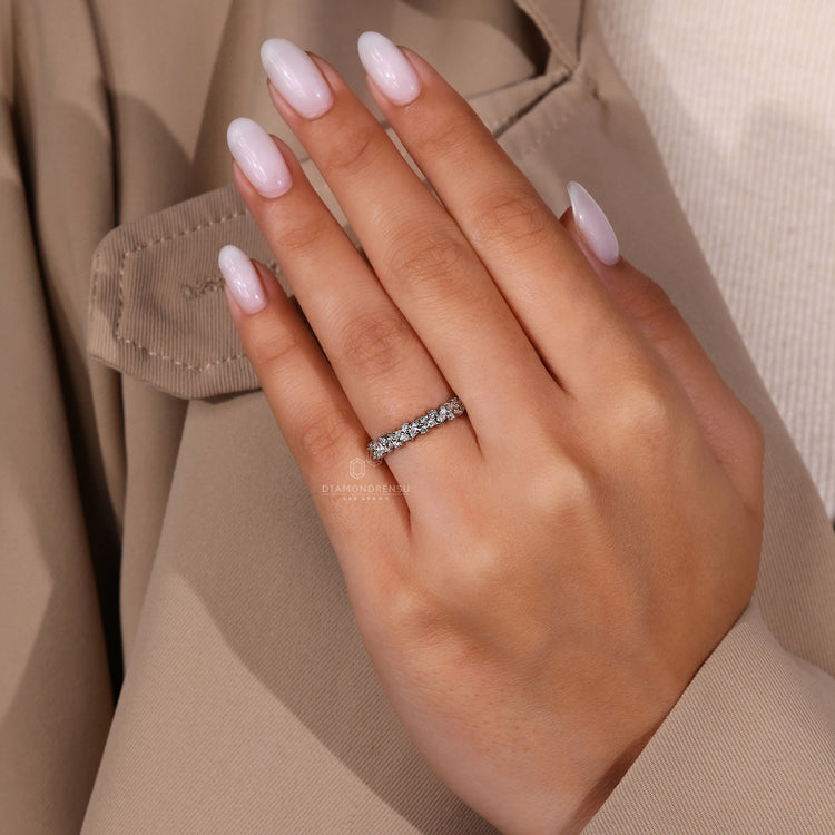 Handmade Band with pear and round lab grown diamonds.
