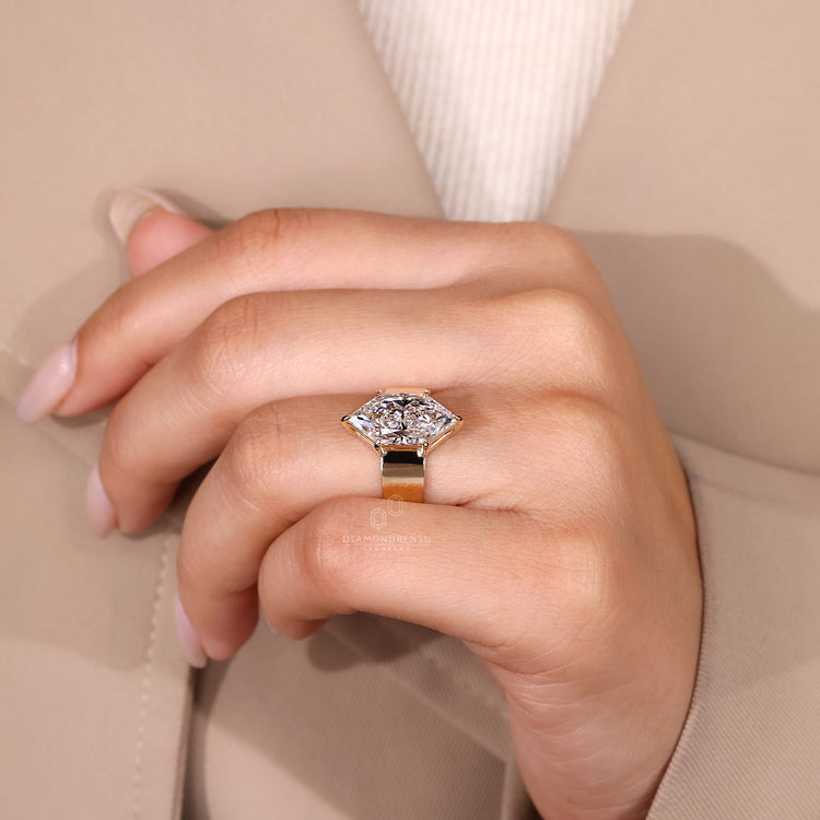 Basket setting ring with solitaire marquise diamond.
