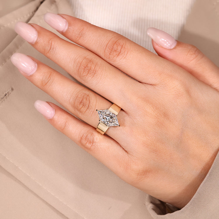 Handmade ring with solitaire diamond and basket setting.