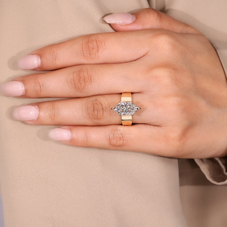Diamondrensu AU ring with Dutch marquise solitaire diamond.