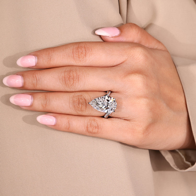 Pear cut diamond ring available in every metal.