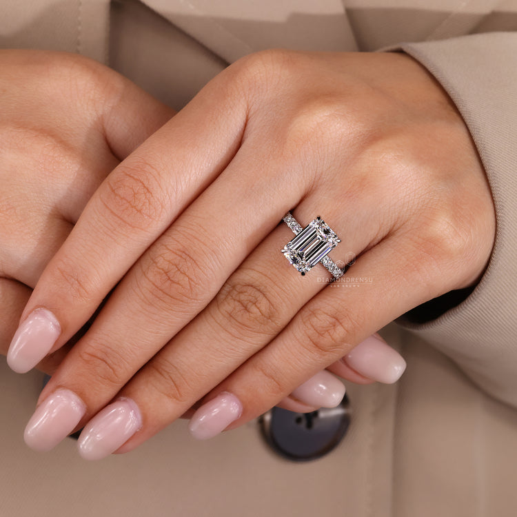 Handmade jewellery emerald cut diamond ring with pave diamonds.