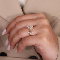 Marquise and round side stone used in yellow gold diamond ring.
