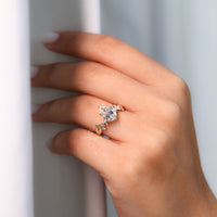 6 leaf style prong added to marquise and round side stone.
