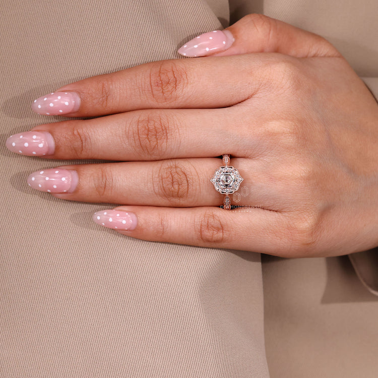 Hexagon Cut Diamond Ring with round pave accents.

