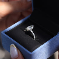 Elegant marquise diamond ring featuring hidden halo sparkle.
