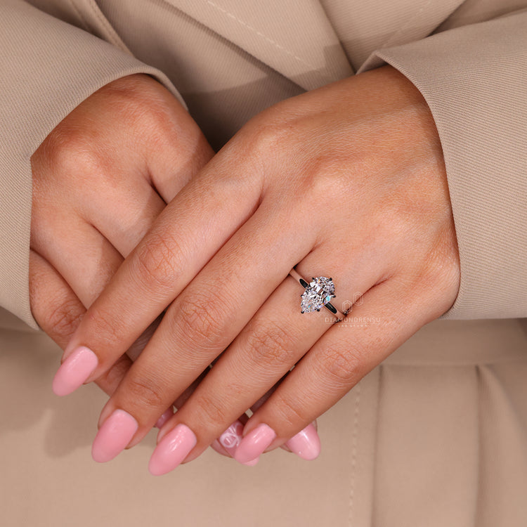 IGI certified diamond ring designed as a pear solitaire engagement style.
