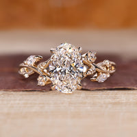 Oval diamond engagement ring with oval cluster diamond ring.
